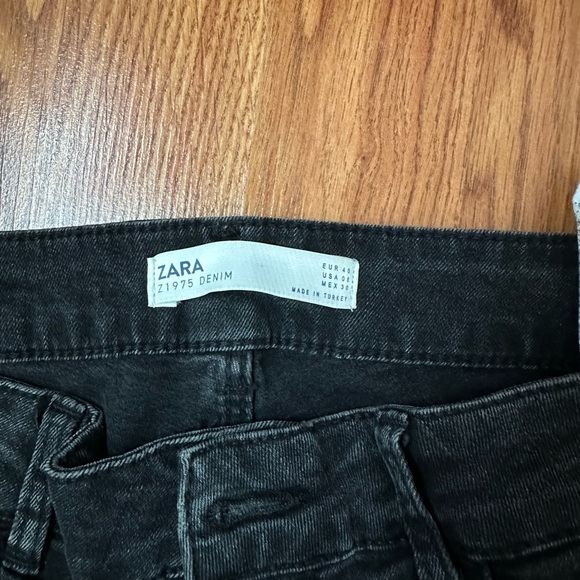 Black zara jeans, slightely distressed, and red stripes on side. - Picture 3 of 5